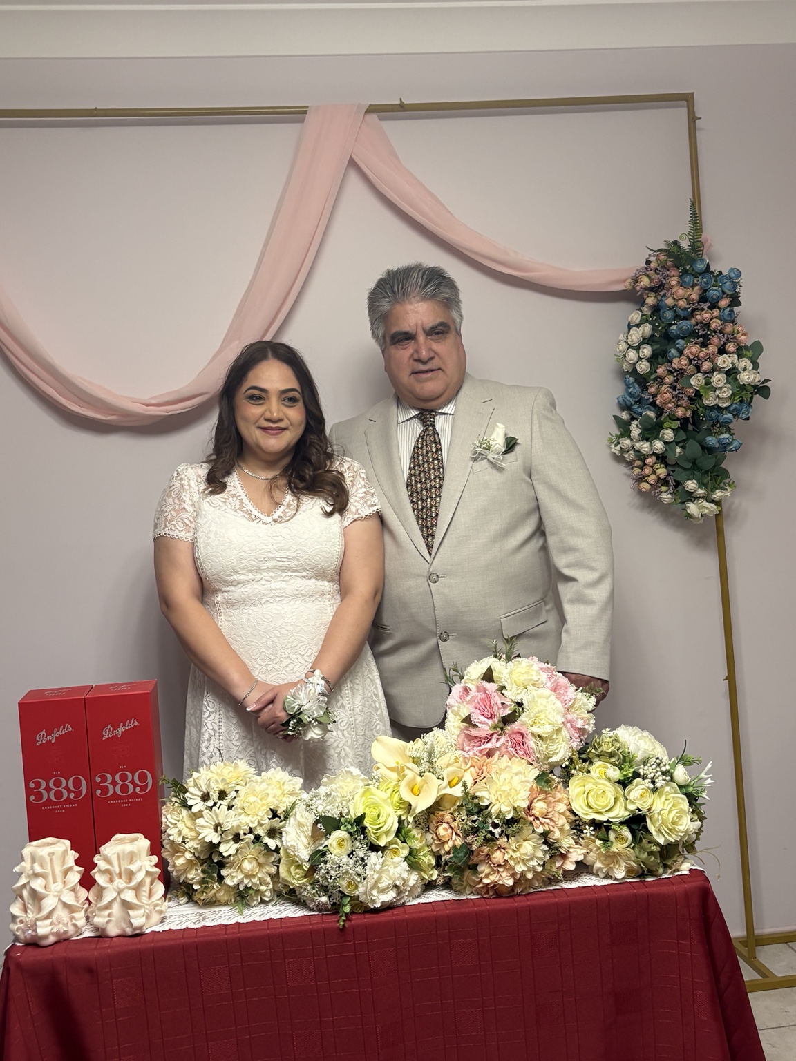 Sara and Shahnam surrounded by flowers