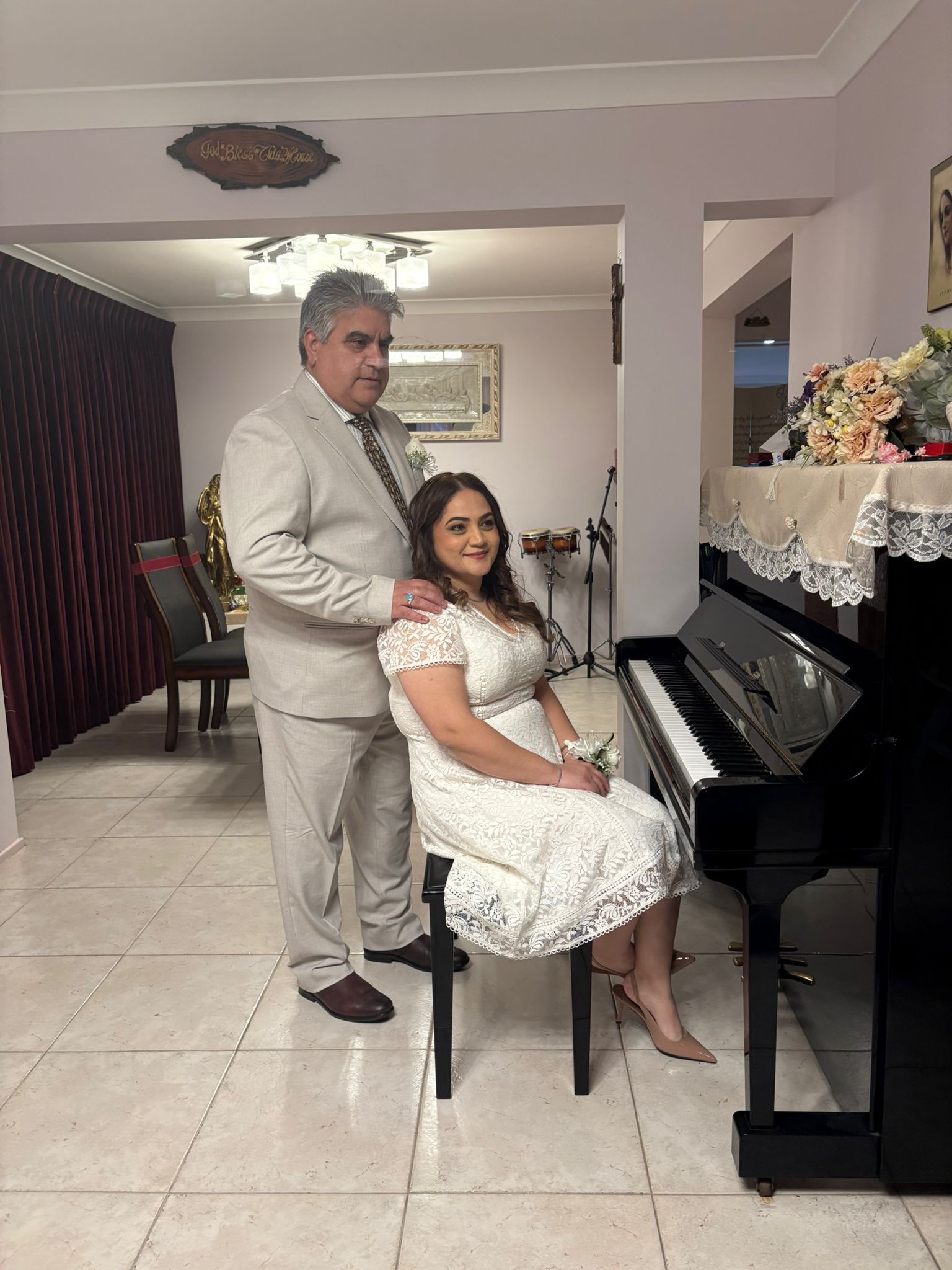 Sara and Shahnam together beside a piano